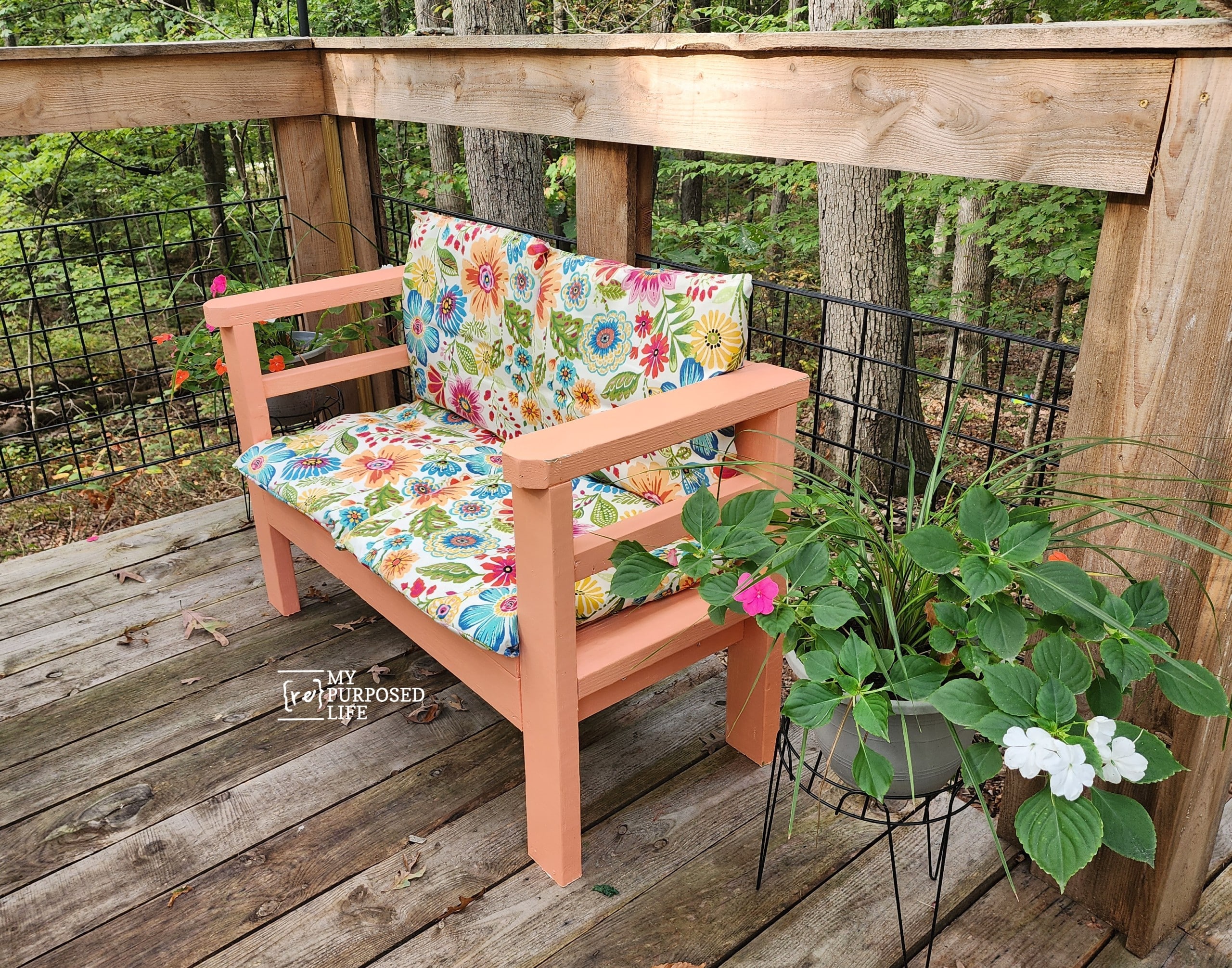 orange outdoor sofa with floral cushions