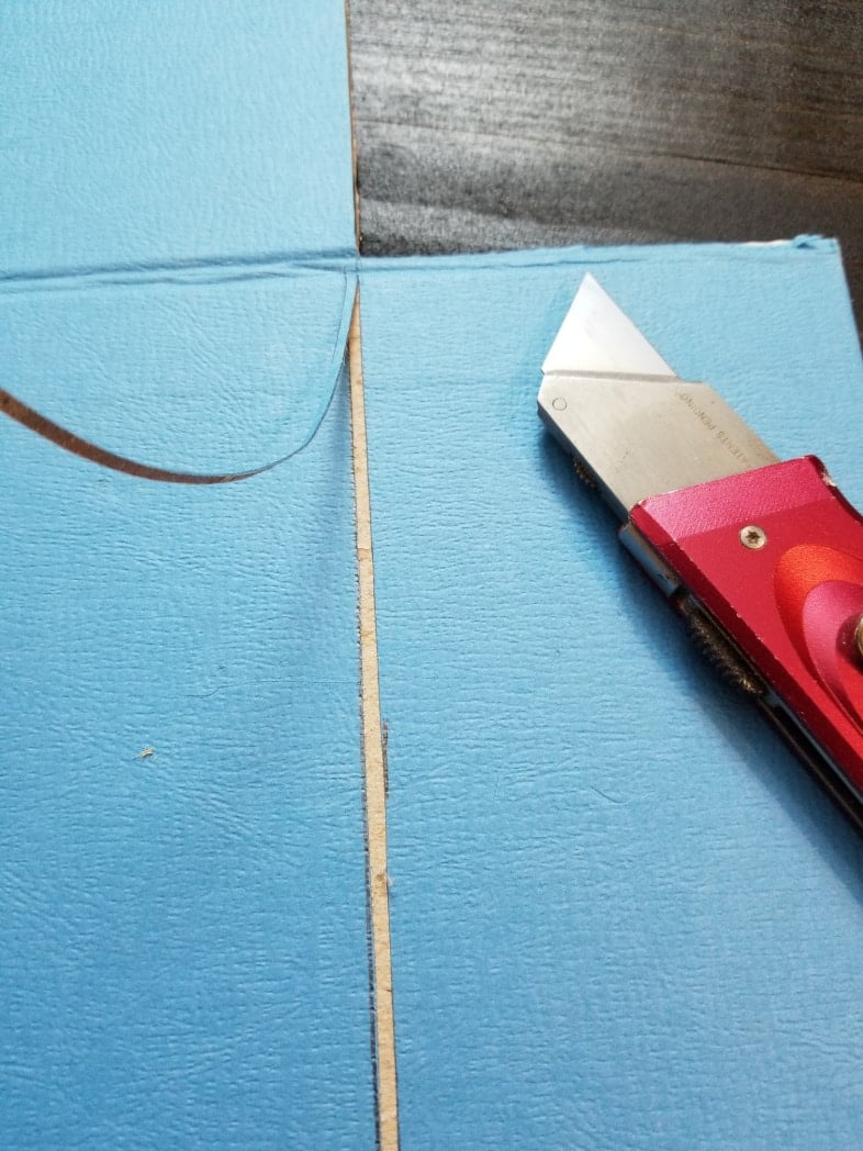 utility knife removes strip of cardboard