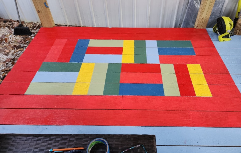 painted porch rug with bright primary covers