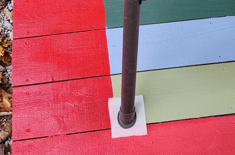 small piece of parchment paper under porch swing leg
