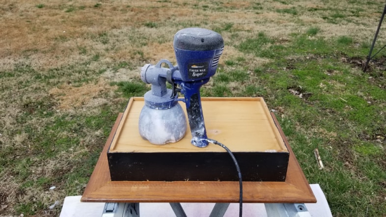 piant sprayer resting on the back of a drawer