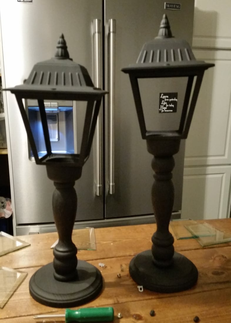 spray painted diy Christmas Lanterns made from porch lights and spindles