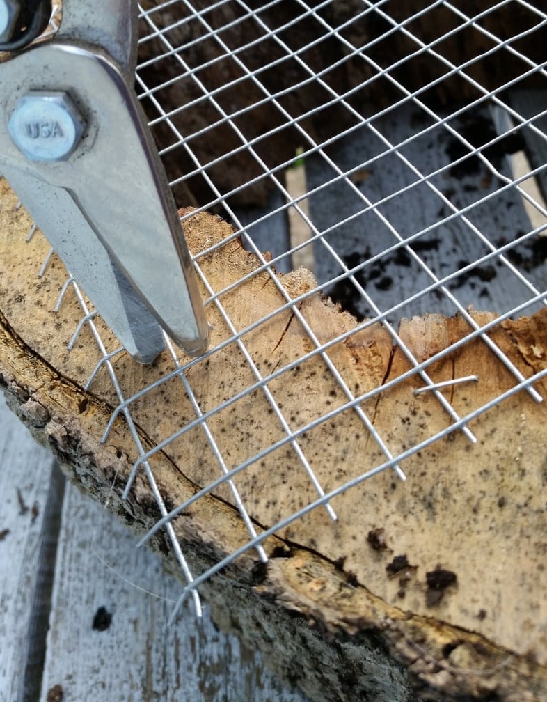 snips removing extra hardware cloth