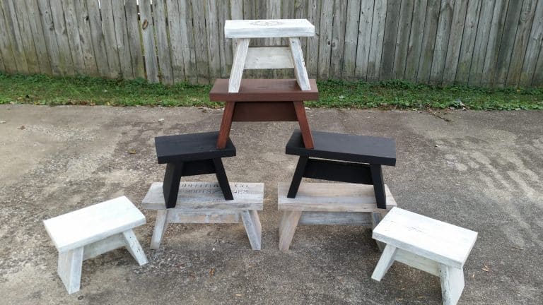 eight wooden DIY wooden stools stacked in a pyramid shape