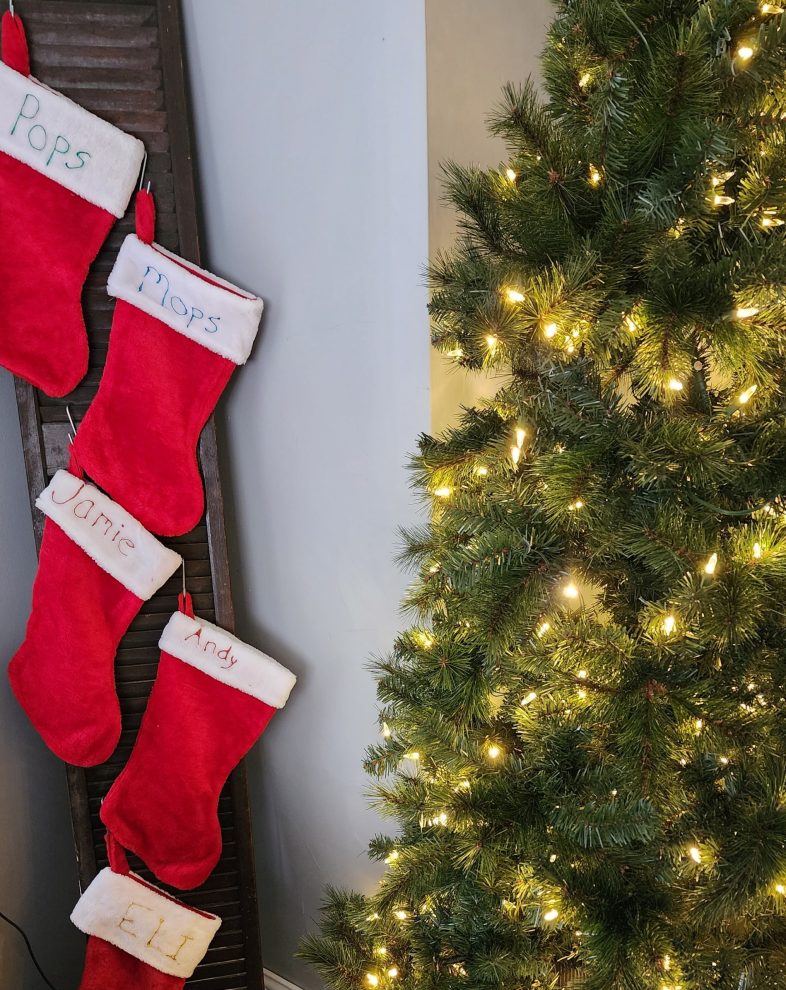 reclaimed louvered door holds stockings