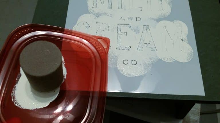 stenciling milk and crean onto a wooden stool