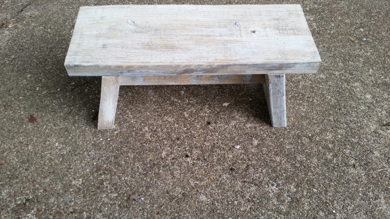 small whitewashed wooden stool