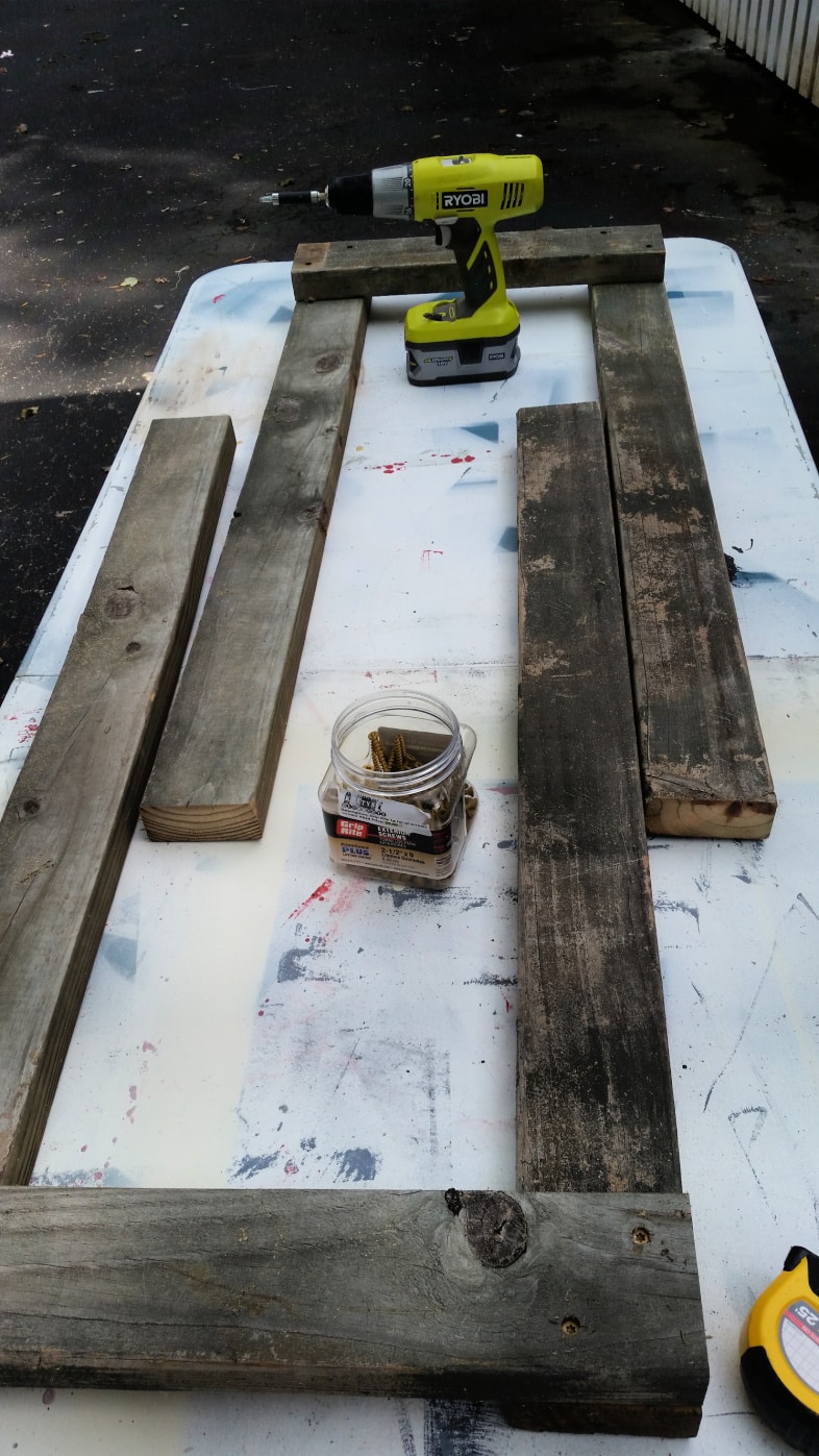 two sets of legs laying on work table