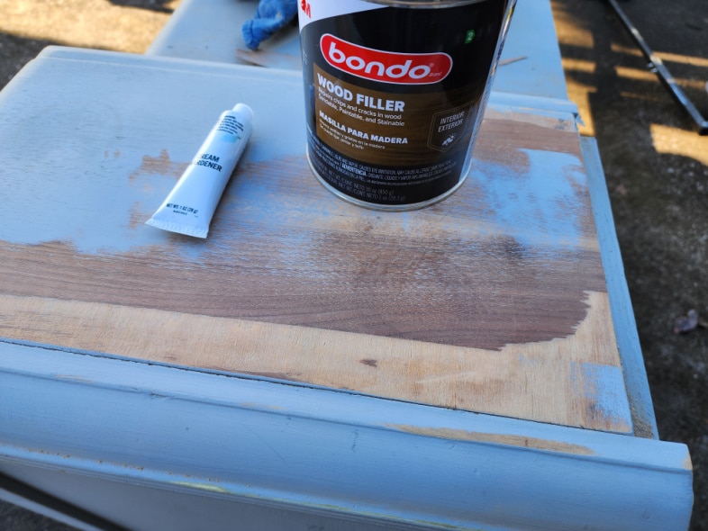 vanity with bad veneer, a container of wood bondo