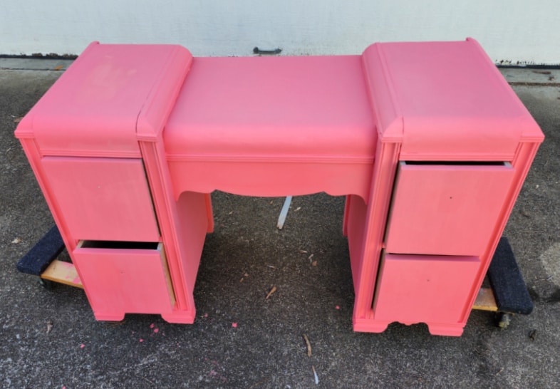 bright pink art deco vanity with drawers