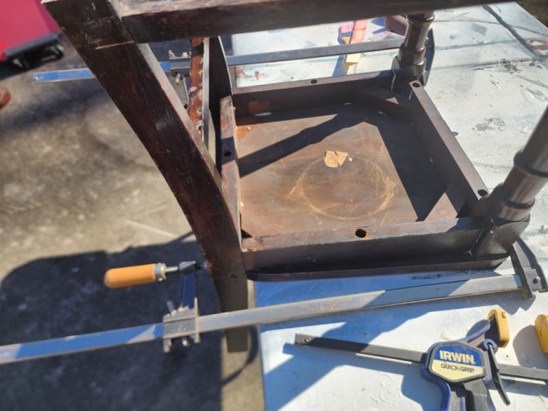 bar clamps holding chair together