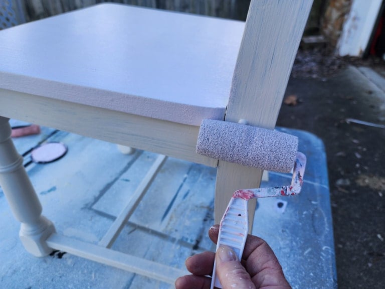 small foam paint roller painting a chair