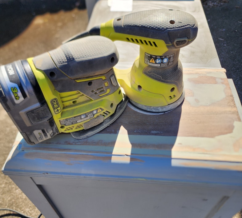 sanding top of vanity with power sanders