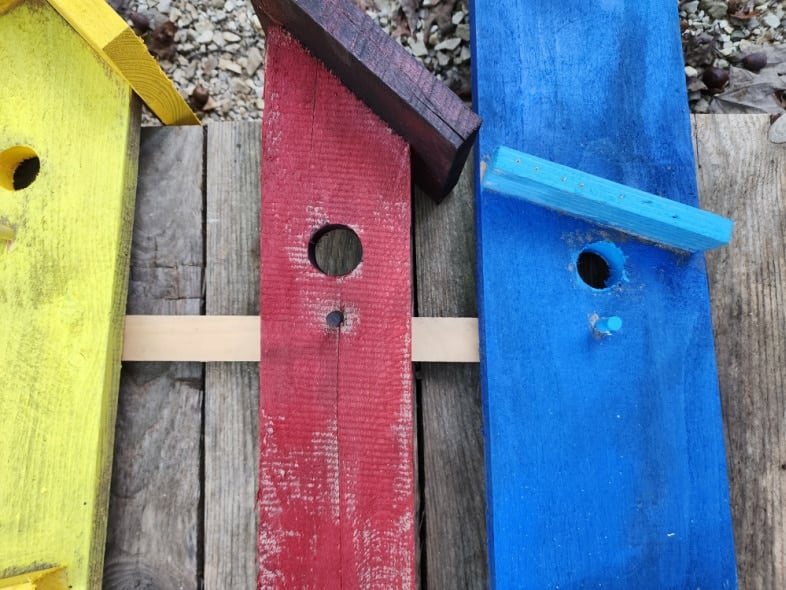 yellow, red, blue birdhouse boards