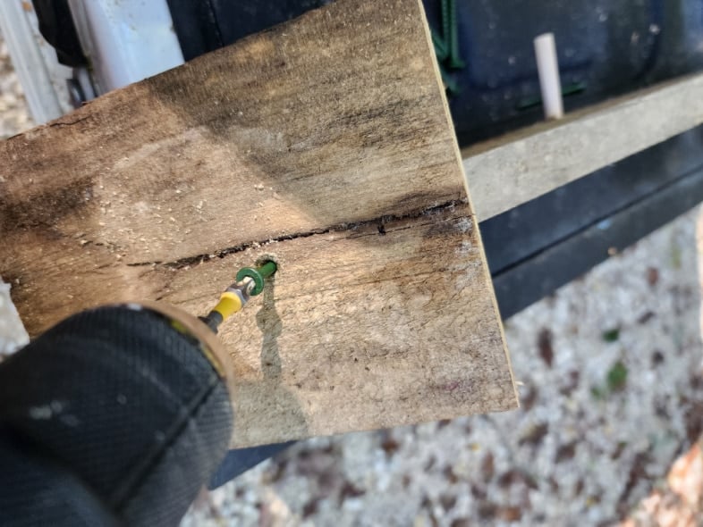 drill screwing the roof in place