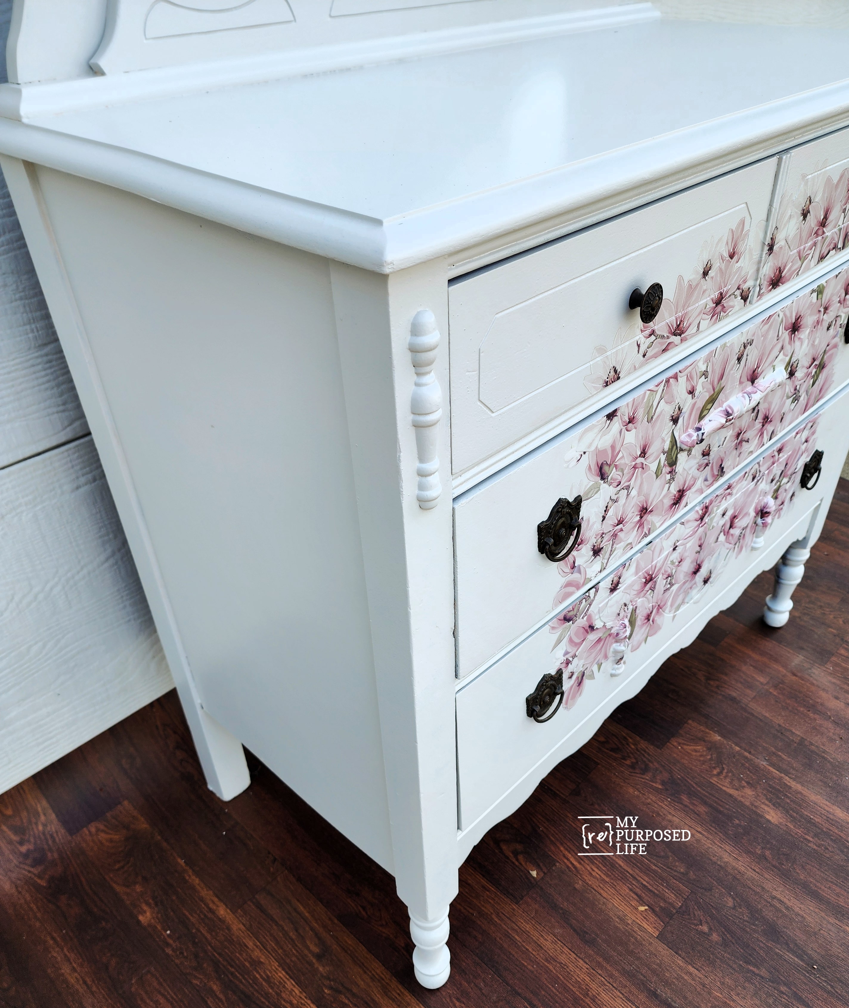 sideview of dresser with pink flowers on the front