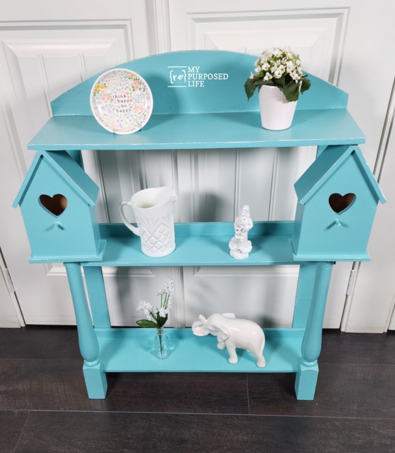 small blue country shelf with white decor