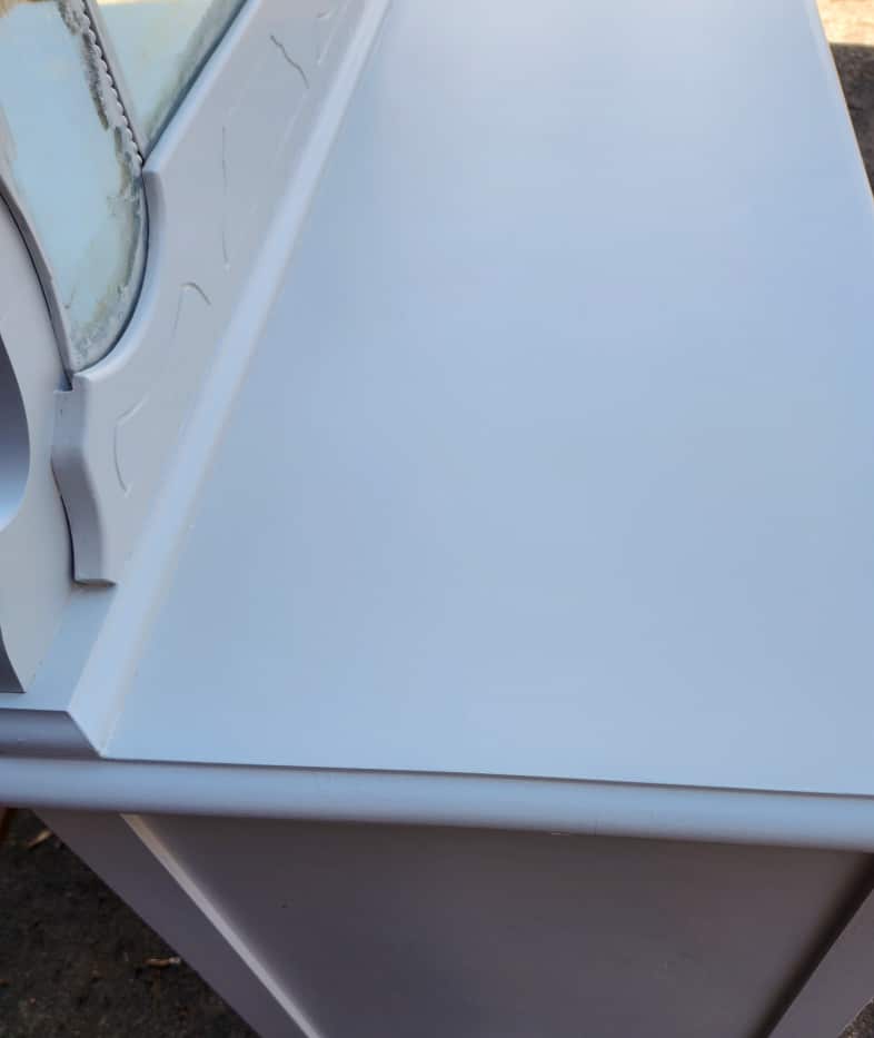 closeup of smooth light gray dresser top