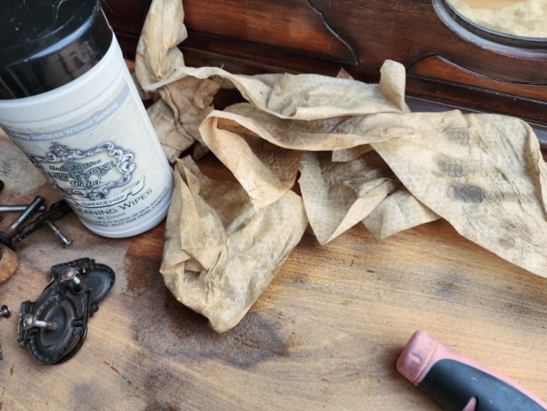 dresser top with dirty surface prep wipes