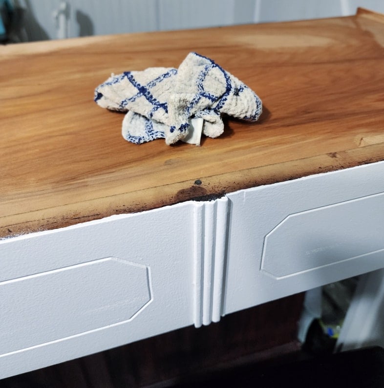wet cloth laying on dresser drawer