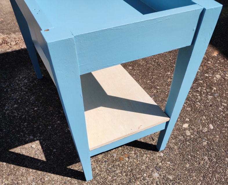 DIY piano bench makeover adding a lower shelf