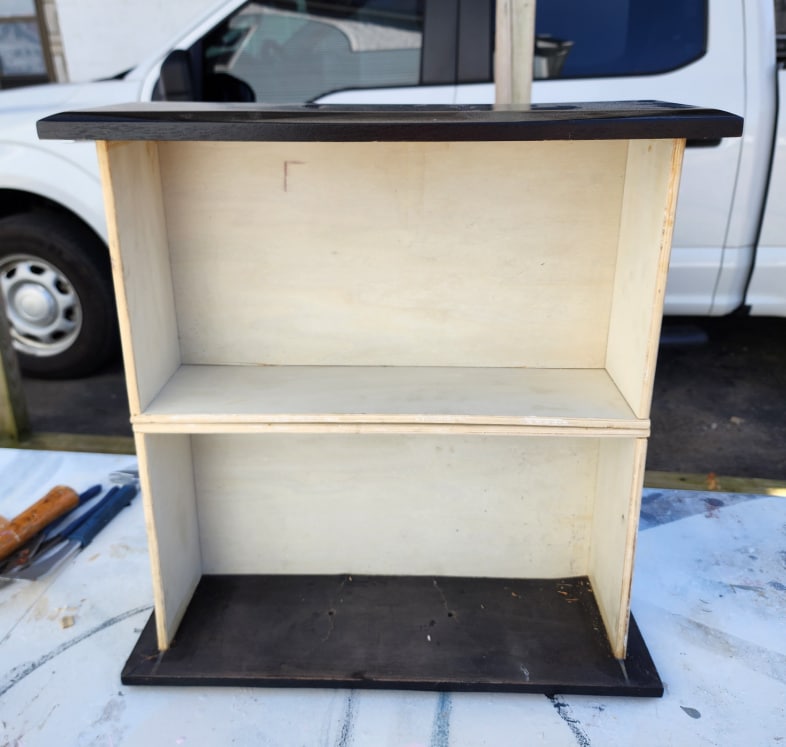 two dresser drawers stacked atop one another