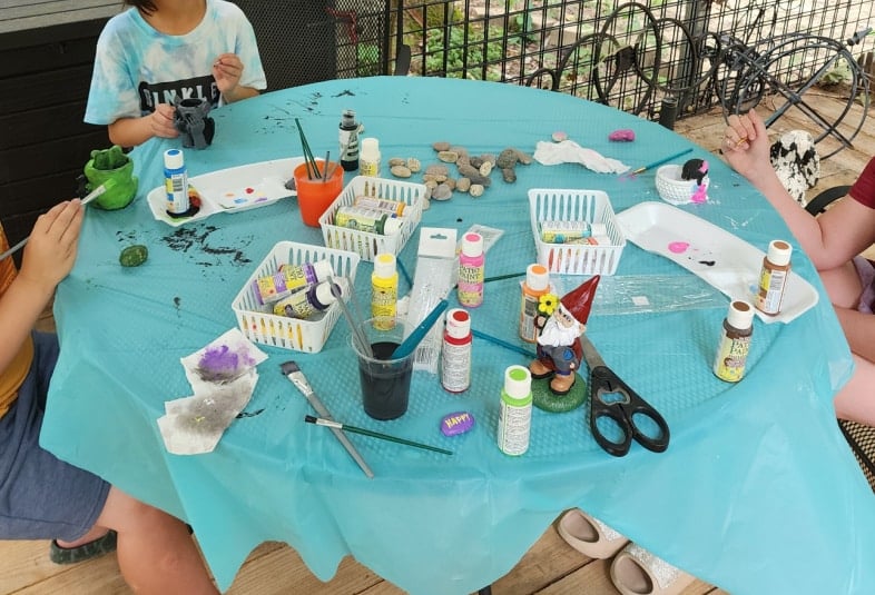 camp grandma kids painting statues