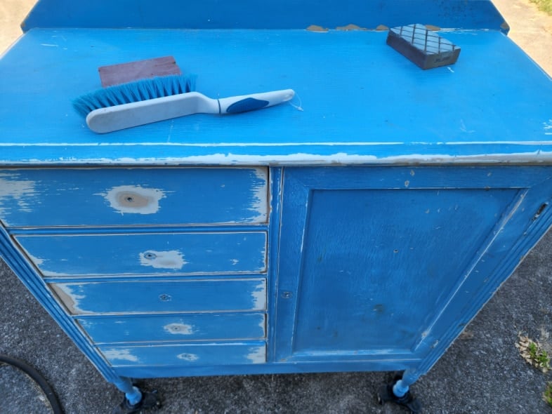 chippy old paint-cleaning sanded blue wardrobe