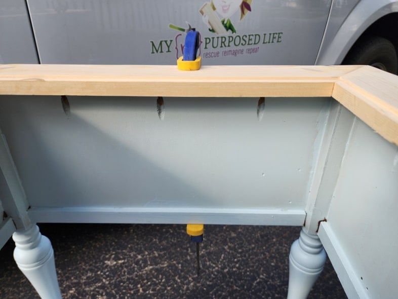 attach prep station cutting board inset to sewing cabinet