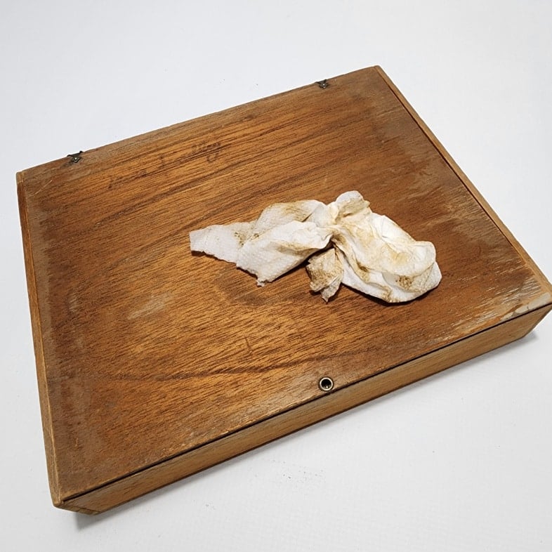 damp paper towel wipes away sanding dust