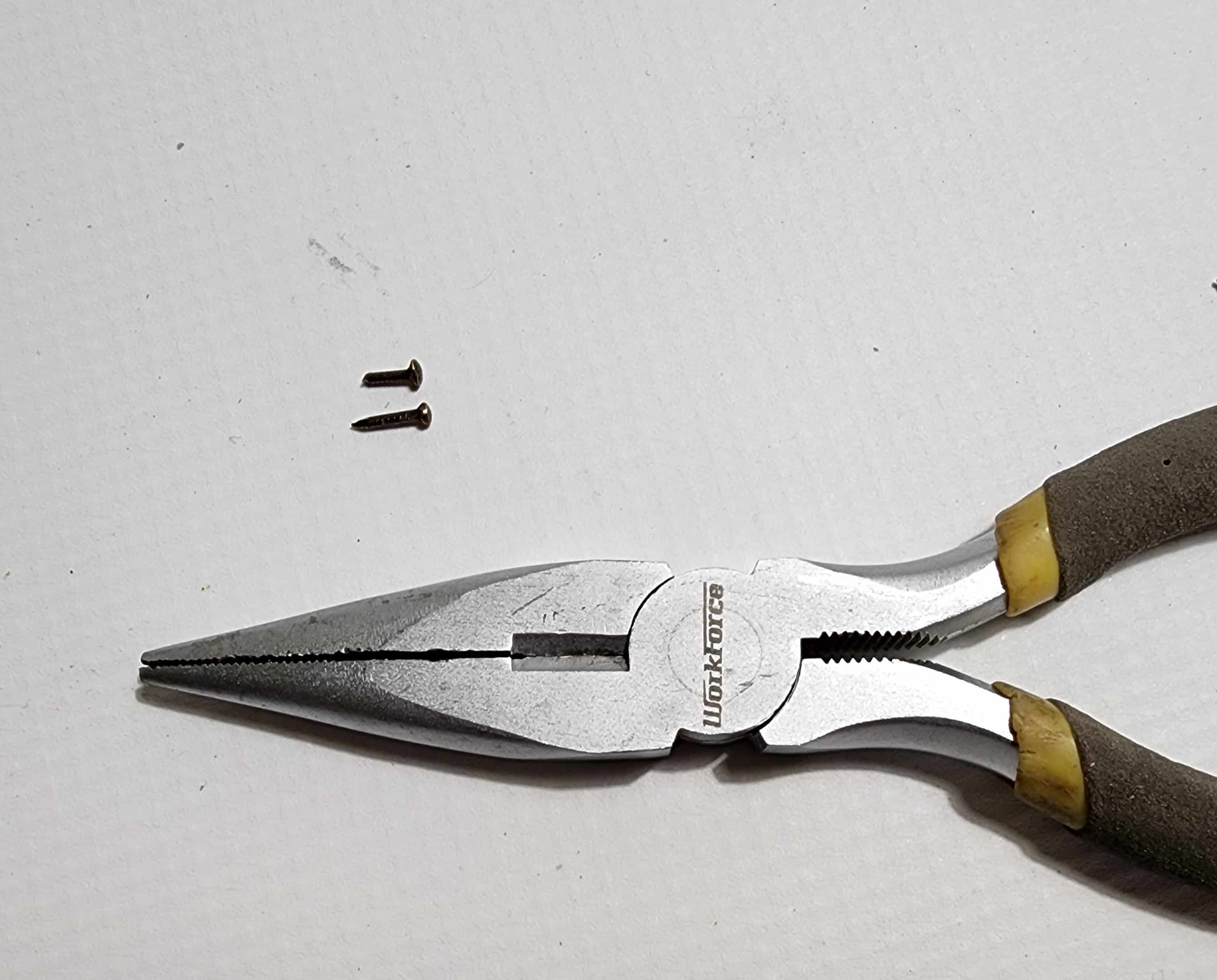 needle nose pliers two snall nails