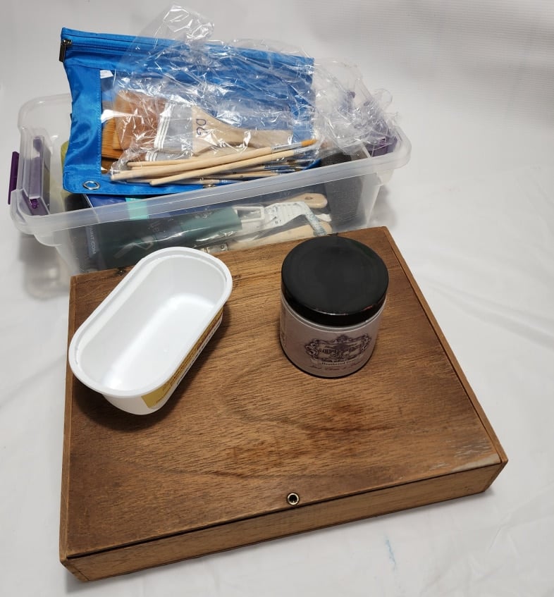 paint brush storage in plastic shoe box tote