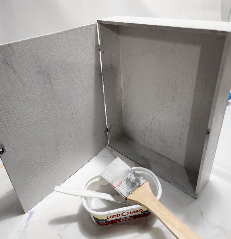 painting a small wooden box light gray