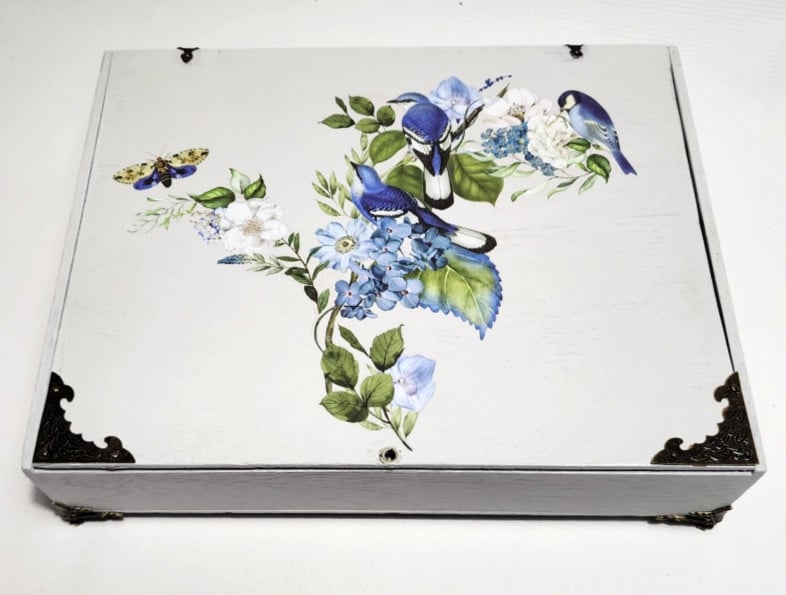 pretty light gray wooden box with blue furniture transfers