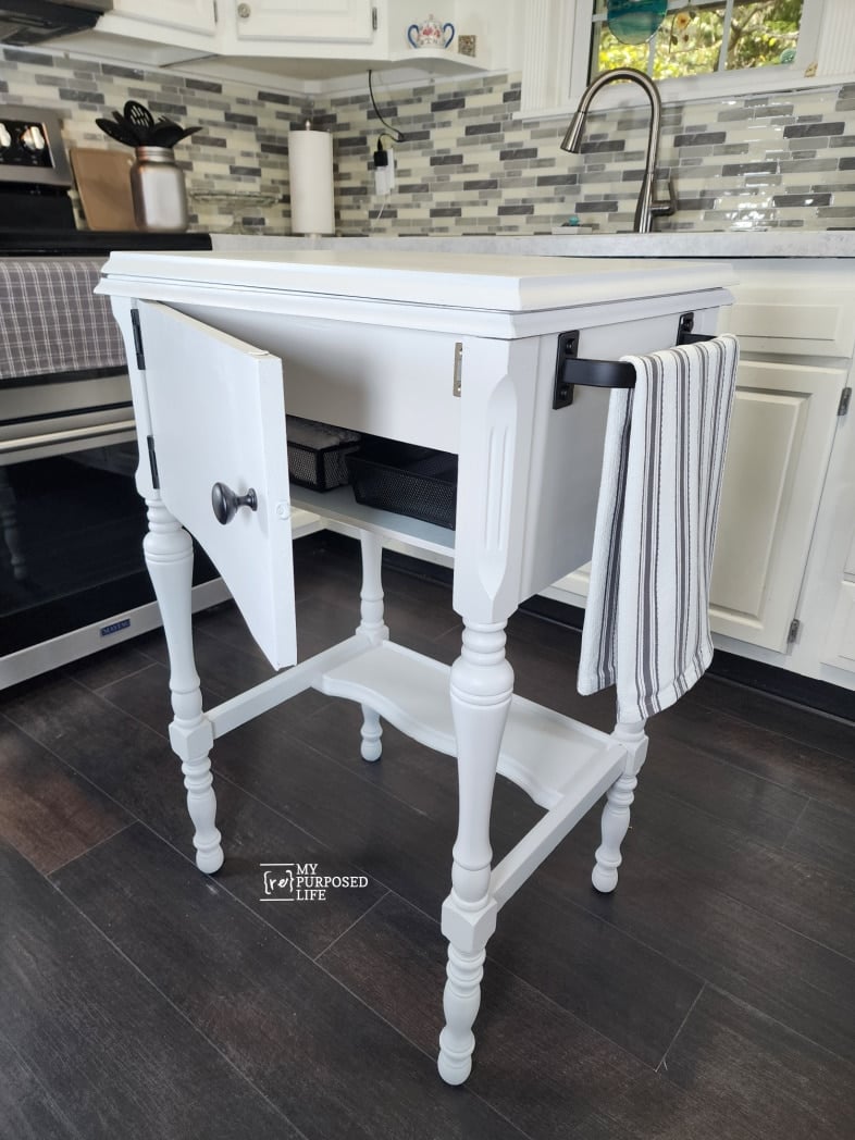 small island with cabinet door open