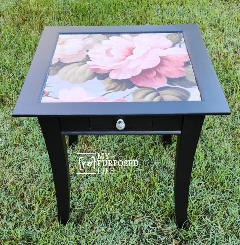 black side table with floral decoupage paper