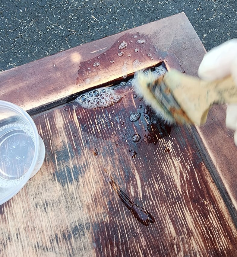 brush on surface prep to clean table before painting