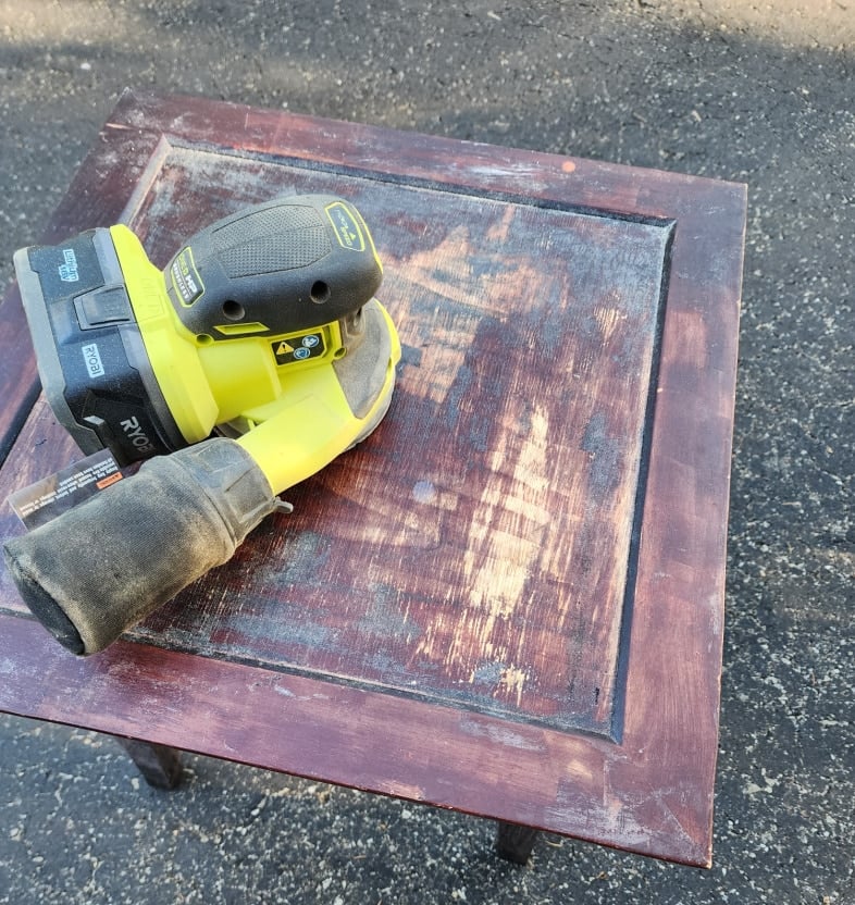 orbital sander on square side table