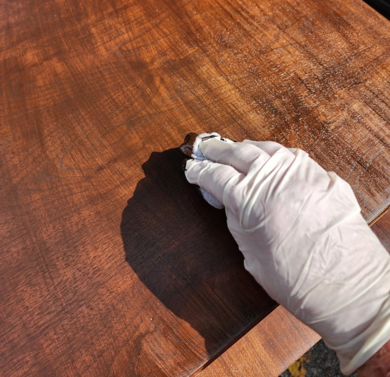 applying gel stain with a soft cloth