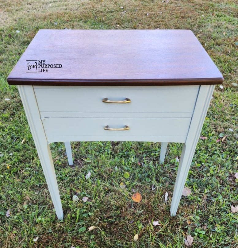 pretty green sewing table with brass handles