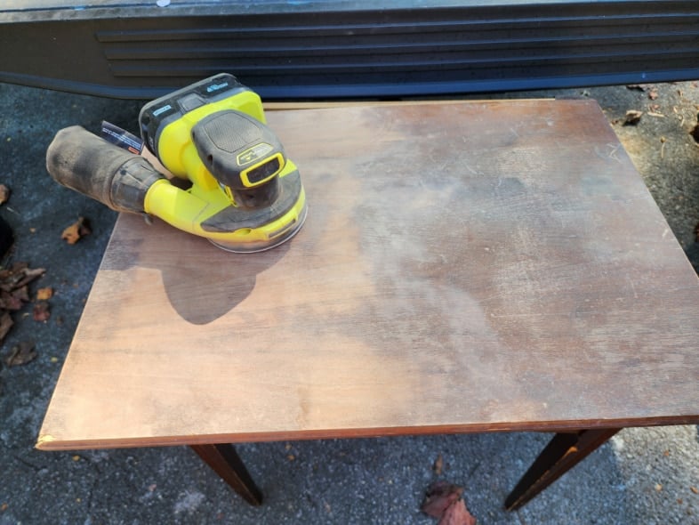 sand the blemishes off the cabinet lid