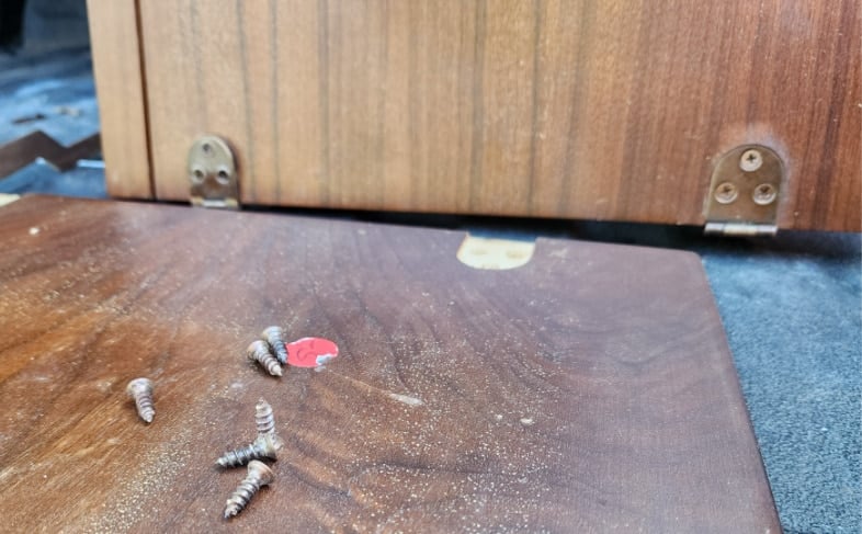 sewing machine cabinet lid removed from mounting board