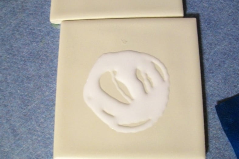 apply decoupage medium to tile