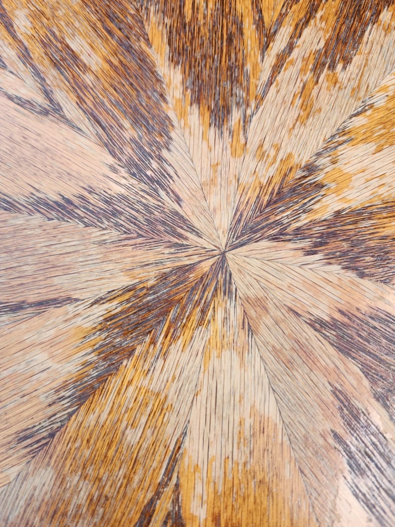 closeup of worn finish on oak kitchen table