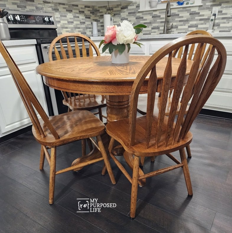oak table with four chairs in the kitchen