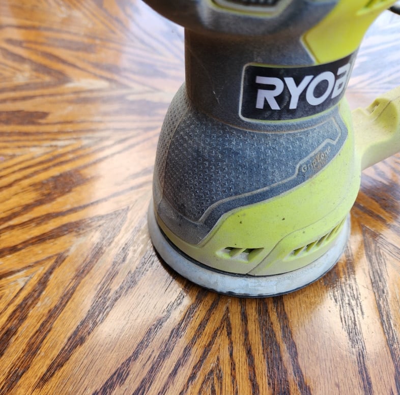orbital sander sanding worn finish