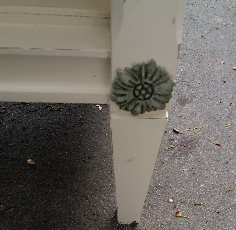 clay mold applique embellishes cabinet