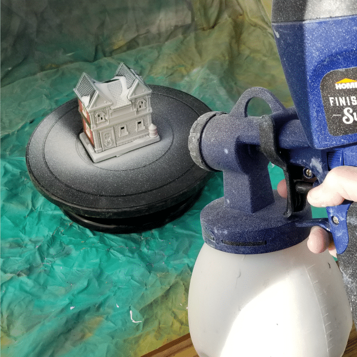 finish max spraying Christmas village building