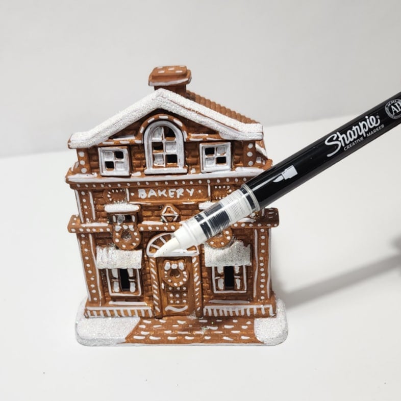 sharpie paints a gingerbread house white