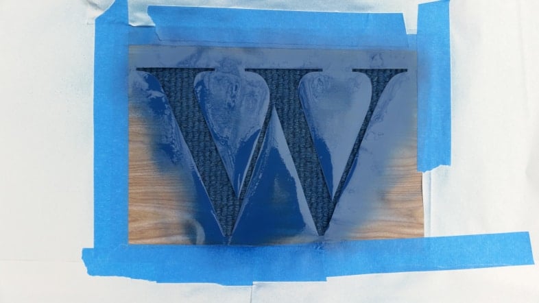 spray painted monogrammed welcome mat